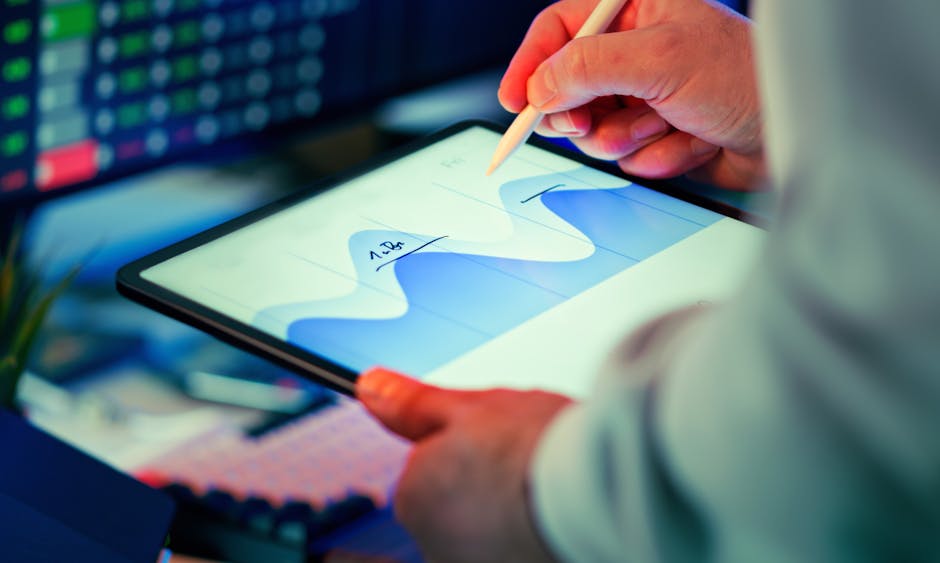 Data analyst reviewing CRM scoring and pricing comparison on tablet