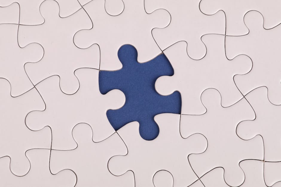 White jigsaw puzzle with one missing piece symbolizing incomplete software solution