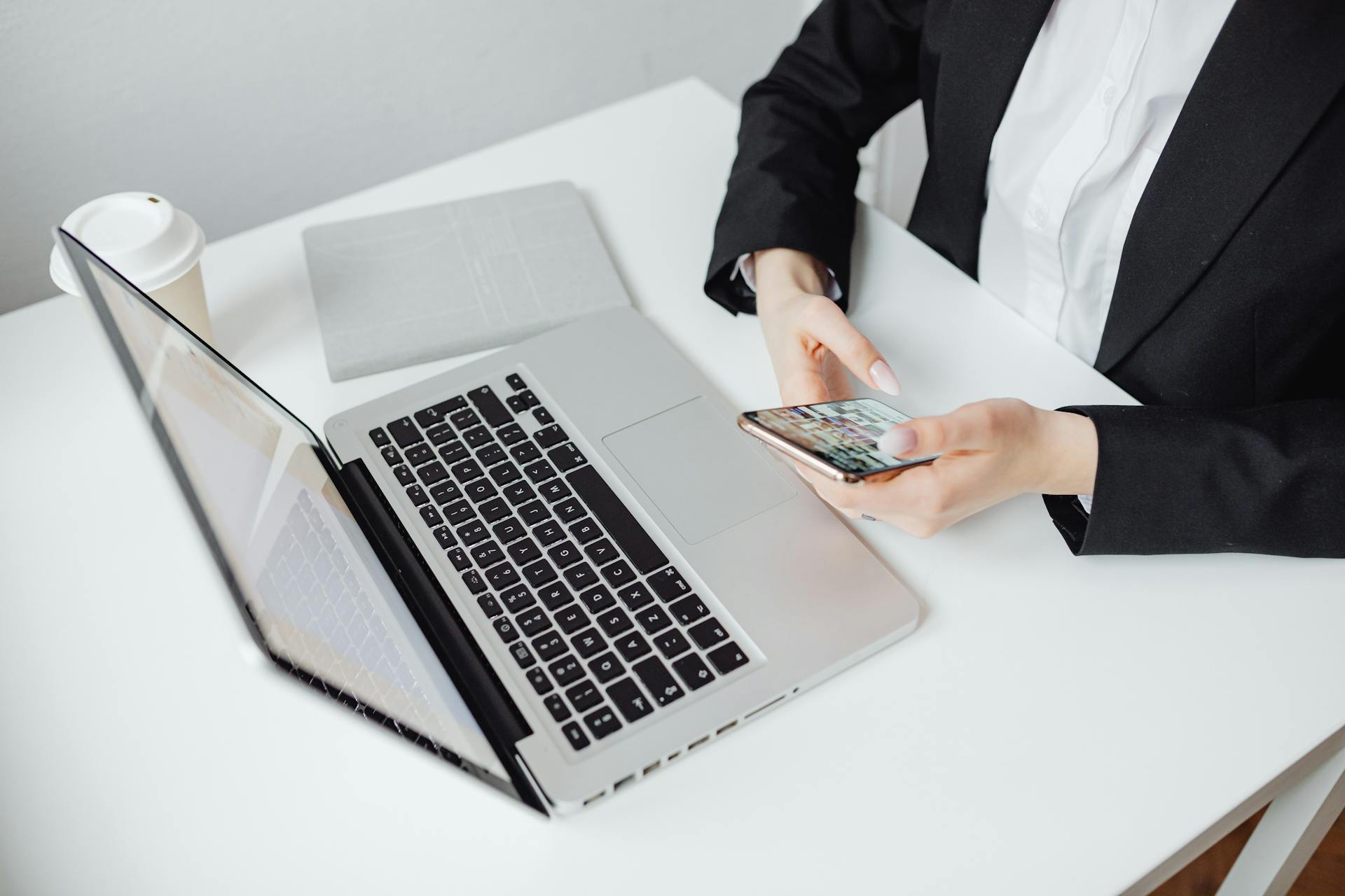 Businesswoman using modern SaaS software on smartphone