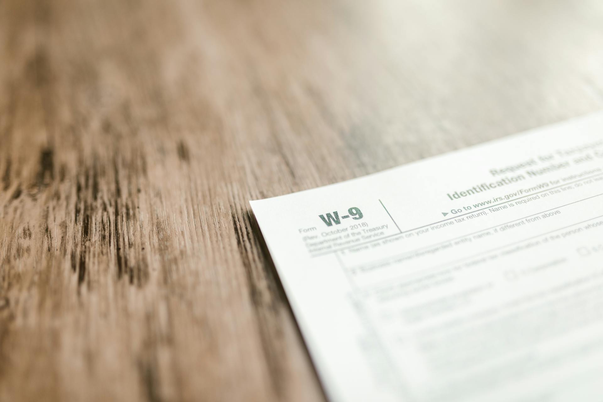 Close-up of form document on wooden desk