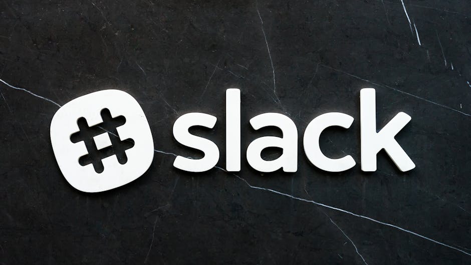 Slack logo on dark textured background representing multiple software tools