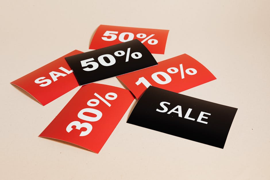 Red and black sale tags showing various discount percentages representing flat rate pricing