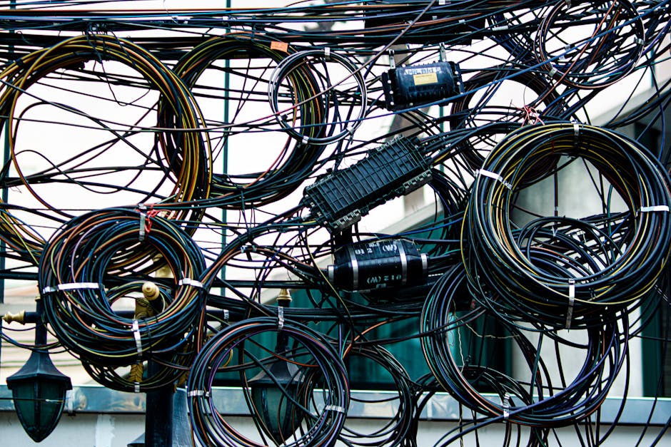 Intricate network of tangled cables representing complex tool integrations