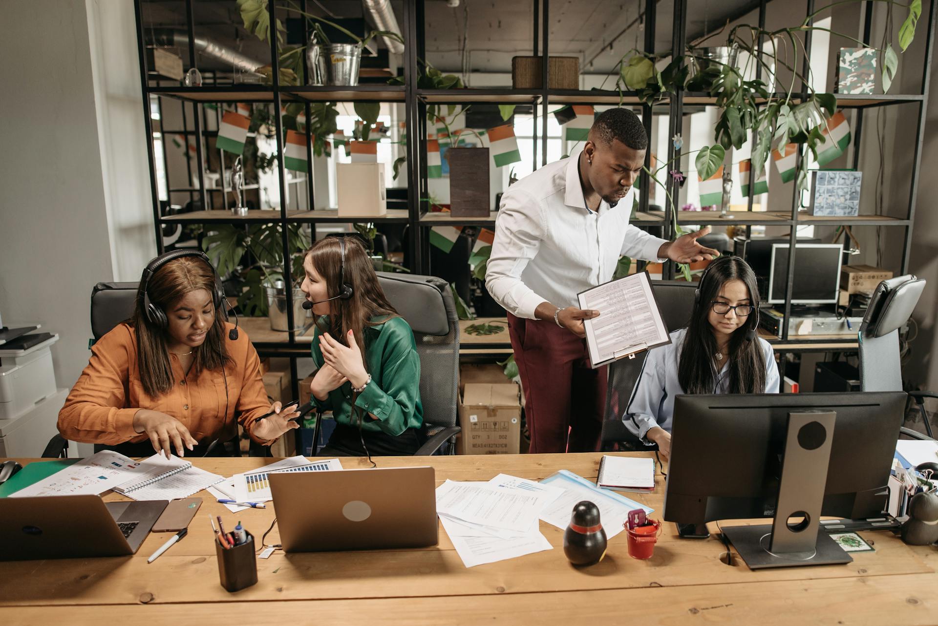 Call center team collaborating in office