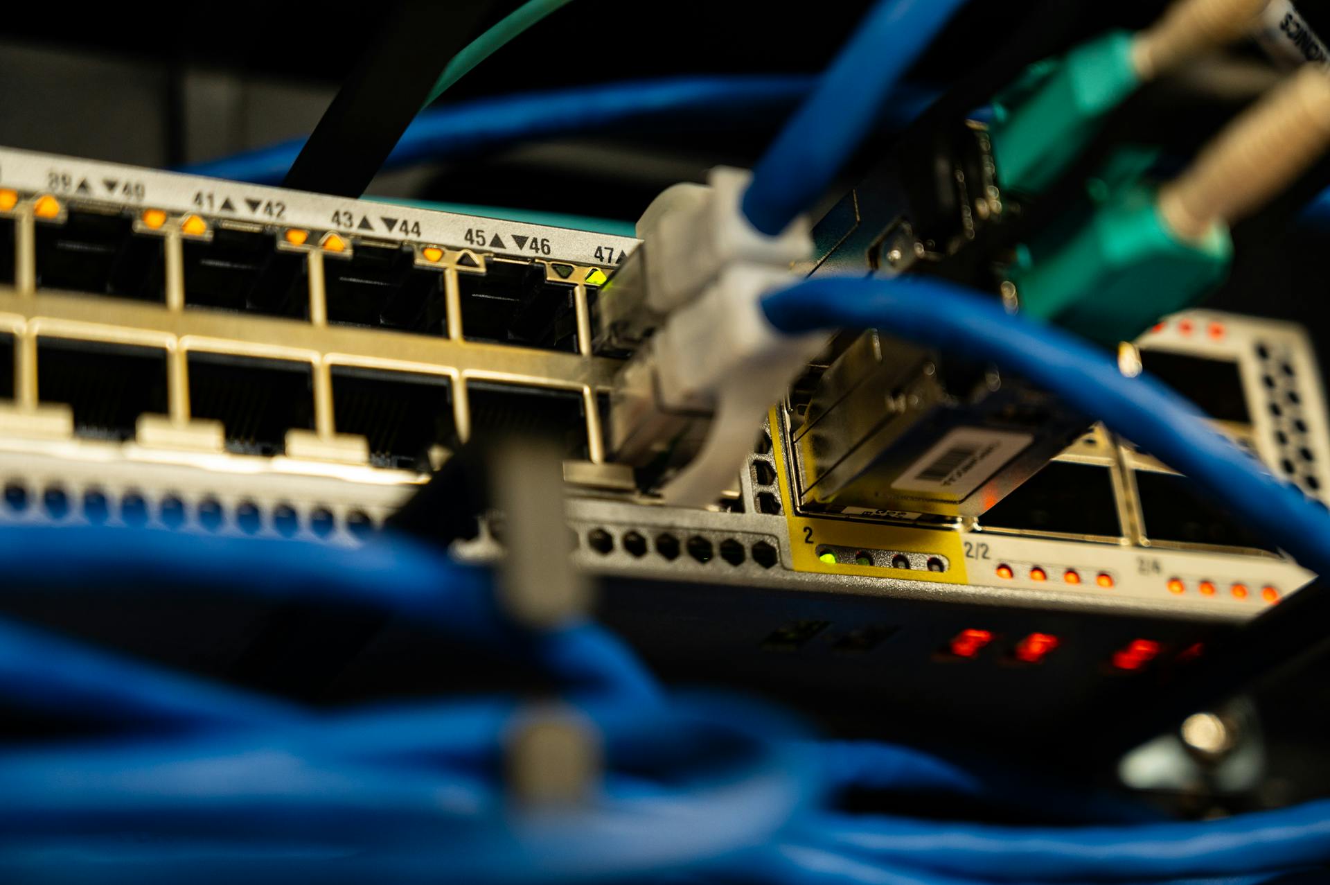 Ethernet cables plugged into network switch for email server configuration