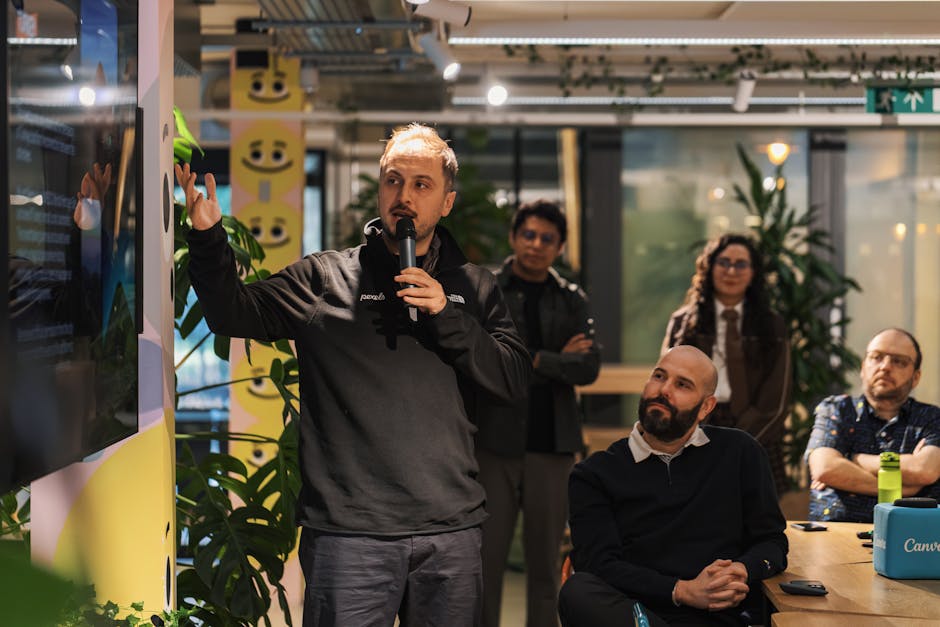 Business presenter training a team in a modern office, representing the importance of CRM onboarding and adoption